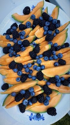 blueberries, blackberries and melon on a plate with watermelon slices