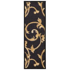 a black and gold door mat with an ornate design