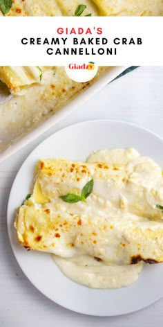 a white plate topped with cheese covered crepes