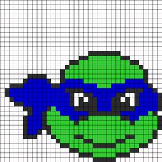 a pixellated image of an alien head in blue and green