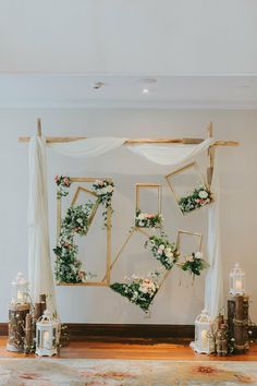 the wedding arch is decorated with flowers and greenery