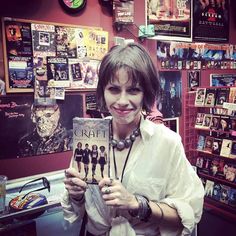 a woman holding up a book in front of her face