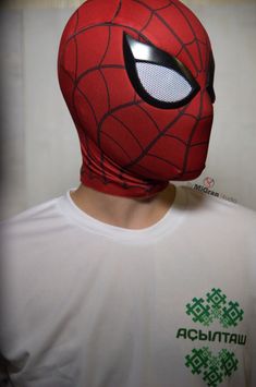 a man wearing a spiderman mask with eyes