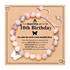 a bracelet with a butterfly charm on it and the words,'10th birthday you make the world a more beautiful place '