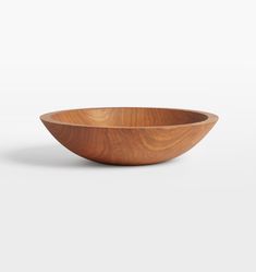 a wooden bowl on a white background