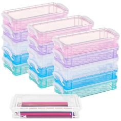 four plastic storage containers with colored pencils in them