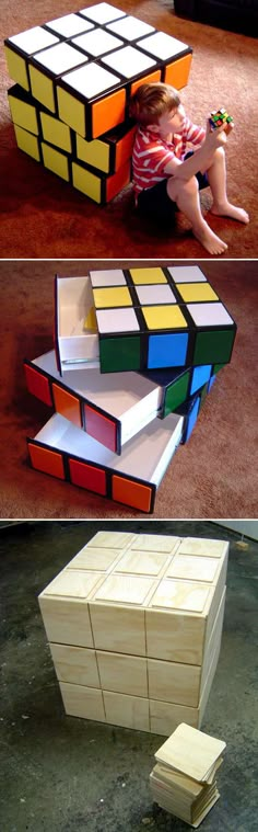 a child is sitting on the floor playing with a rubik cube puzzle and it looks like he's trying to build something out of wood