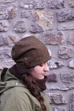 "l love this hat! I designed this hat with a more modern slouchy shape, using the exquisite Harris Tweed which I love to work with in the Autumn and Winter. It is so comfortable and warm as it covers the ears on those cold days. Harris Tweed is hand-woven by islanders in their homes in the Outer Hebrides and is made from pure virgin wool dyed and spun in the Outer Hebrides. This is what entitles it to carry the famous Orb Mark certifying it as Harris Tweed. lined with organic bamboo jersey which Autumn Hat, Wool Cloche Hat, Tweed Hat, Outer Hebrides, Fall Hats, Winter Cap, Winter Hats Beanie, Hat Beanie, Slouchy Hat