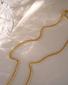 Make a statement with the Tribeca Curb Chain Choker! Perfect for layering and creating unique looks, this choker will provide a subtle but bold look. Express yourself and show off your style with the Tribeca Curb Chain Choker! NECKLACE FEATURES Material: Brass, 16K Gold Filled Chain Dimension: 3X2.2mm Chain Thickness: 0.4mm Chain Style: Curb Chain Lead Free, Nickel Free Size: 16" with 2" chain extender