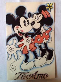 a drawing of mickey and minnie mouse hugging each other with the word texma written on it