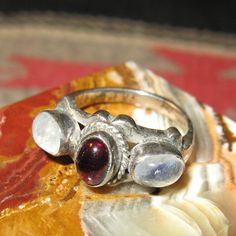 Sterling Cabochon Garnet & Blue Flash Moonstone Ring, Size 6, 6 grams. Antique Silver Moonstone Cabochon Ring, Spiritual Multi-stone Moonstone Ring, Mystical Silver Moonstone Cabochon Ring, Silver Bohemian Moonstone Cabochon Ring, Vintage Sterling Silver Cabochon Crystal Ring, Spiritual Moonstone Cabochon Ring, Garnet Ring Silver, Three Necklaces, Garnet Rings