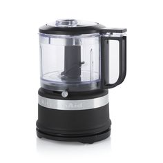 a black and silver food processor on a white background