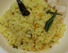 a white bowl filled with rice and vegetables