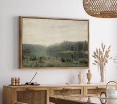 a painting hanging on the wall above a dining room table