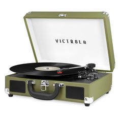 a suitcase with a record player in it and the word victoria printed on the side