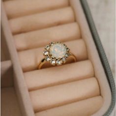 This Stunning 14k Gold Plated Ring Features Cubic Zirconia Crystals Surrounding The Moonstone Center. It Fits A Size 7 And Elevates Any Look. Gold Opal Ring With Halo Design - Gift, Elegant Opal Cluster Ring, Elegant Opal Cluster Ring With Gemstones, Gold Opal Ring With Halo Design, Elegant Opal Crystal Ring As Gift, Elegant Opal Crystal Ring With Birthstone, Elegant Opal Crystal Ring For Gift, Elegant Opal Birthstone Crystal Ring, Gold Moonstone Ring With Halo Setting For Promise