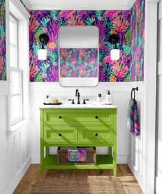 a bathroom with colorful wallpaper and bright green drawers, sink and mirror on the wall