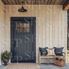 the front porch is decorated with blue and white pillows, a bench, and potted plants