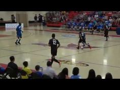 the basketball game is being played on an indoor court