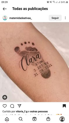 a tattoo on the arm that reads carara and has an image of a dog's paw