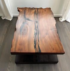 a wooden table that has been made to look like it is being used as a coffee table