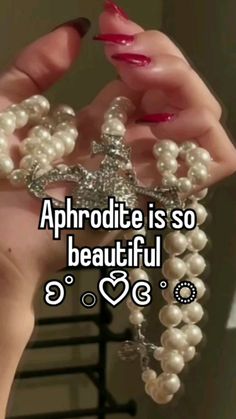 someone is holding pearls in their hands and the words, aphrodite is so beautiful