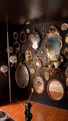 there are many mirrors on the wall in this room