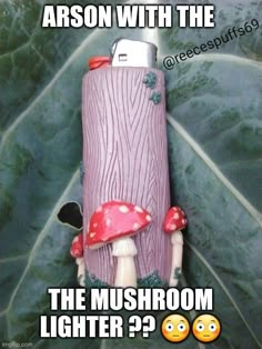 the mushroom lighter is sitting on top of a leaf