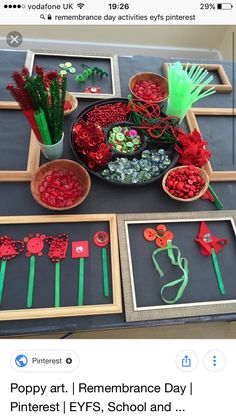 a table topped with pictures and paper flowers