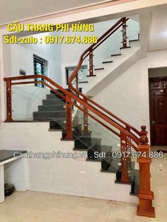 the stairs in this house are made of wood and glass with metal handrails