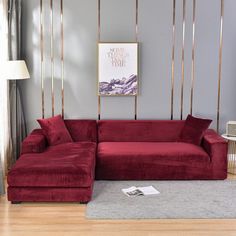 a living room with a large red couch