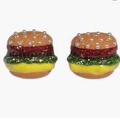 Product Details About This Item About This Item Cute Hamburger Shaped Stud Earrings Feature Faux Pearl Accents On Top Of Bun For The Seeds, Red Glitter Resin Layers For Tomato, Brown Resin With Crystal For Hamburger Patty, Green Glitter Enamel For Lettuce & Yellow Enamel Layer For Mustard. Earrings Approximately 0.7” Inches Long. Post Back Closure Description Betsey Johnson Hamburger On Sesame Bun Faux Pearl Stud Post Earrings Picnic Description New In Box! Add A Delicious Touch To Your Fashion Betsey Johnson Earrings, Rose Stud Earrings, Flamingo Christmas, Betsey Johnson Jewelry, Metallic Pink, Heart Drop Earrings, Pink Daisy, Blue Gems, Purple Stones