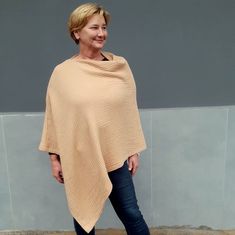 No matter how old you are you can always shine beauty and femininity everywhere you go! This geometric cotton poncho / triangle shawl looks simply gorgeous on women of all sizes and can easily be a plus size shoulder cape for those bigger beautiful ladies as well as a loose fit wrap that is so comfortable to wear for slim/athletic ladies! Made from soft 100% cotton muslin (double gauze) fabric they are easy to take care. Find out for yourself why this warm poncho is so perfect for everyday use i Oversized Poncho Shawl With Scarf Detail, Oversized Cape Shawl For Spring, Oversized Spring Cape Shawl, Oversized Beige Shawl Poncho, Beige One Size Shawl Poncho, Oversized Shawl Poncho, Cotton Shawl Poncho, Shoulder Cape, Triangle Shawl