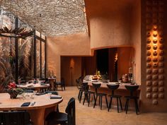 an indoor dining area with tables and chairs