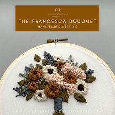 an embroidery kit with flowers on it and the text, the frances bouquet hand embroidery kit