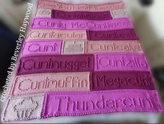 a crocheted blanket with the words love written on it