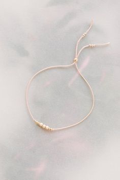 Elegant Resizable Rose Gold Beaded Bracelet, Feminine Adjustable Beaded Bracelets For Wedding, Delicate Adjustable 14k Gold Beaded Bracelet, Adjustable Delicate 14k Gold Beaded Bracelet, Elegant Adjustable 14k Gold-filled Beaded Bracelet, Elegant Rose Gold Friendship Bracelets For Everyday, Everyday Elegant Rose Gold Friendship Bracelets, Minimalist Gold Beaded Bracelets As Bridesmaid Gift, Delicate Tiny Beaded Bracelets For Wedding