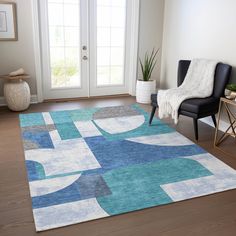 a living room area with a blue and white rug