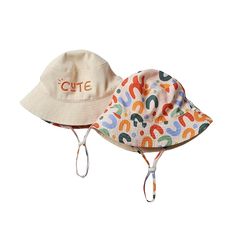 Protect your little one in style with this CUTE Sun Hat! This colorful reversible staple comes complete with one side that declares "cute" on it. So sweet! Playtime Cotton Bucket Hat With Wide Brim, Cotton Bucket Hat With Wide Brim For Playtime, Adjustable Cotton Sun Hat For Playtime, Cotton Curved Brim Sun Hat For Playtime, Adjustable Cotton Bucket Hat For Playtime, Adjustable Cute Cotton Bucket Hat, Cotton Bucket Hat For Playtime, Cute Adjustable Cotton Sun Hat, Cute Adjustable Fit Sun Hat For Spring