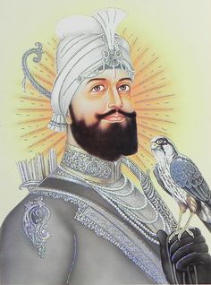 an image of a man with a bird on his arm and wearing a turban