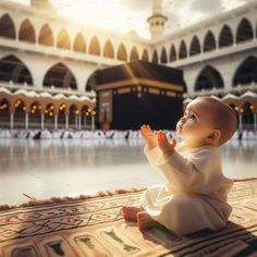 a baby sitting on top of a rug in front of an ornately decorated building