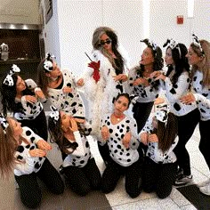 a group of women dressed in dalmatian costumes