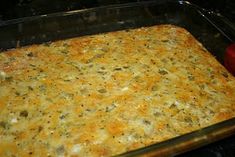 a casserole dish in the oven with cheese and other toppings on it