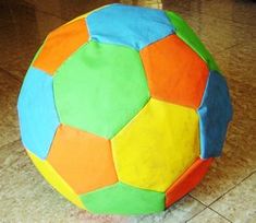 a brightly colored ball sits on the floor