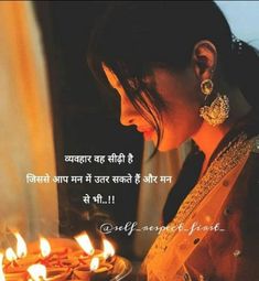 a woman holding a plate with lit candles in front of her and the words happy diwali written on it