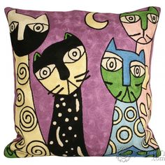 a decorative pillow with cats on it