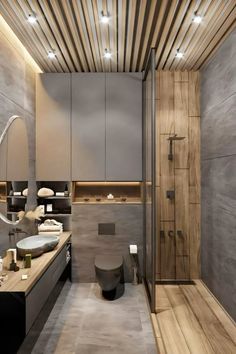 a modern bathroom is shown with wood accents