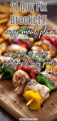 grilled chicken and vegetables on a wooden cutting board with text overlay reading 21 day fix bracket f easy meal plan