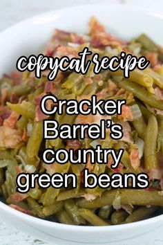 a white bowl filled with green beans and bacon