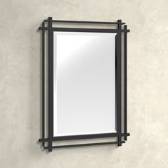 a mirror mounted to the side of a wall